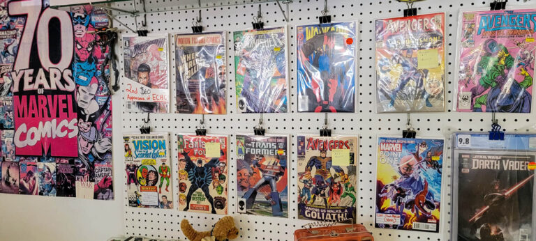 Issues of old Marvel comics on a wall at Ravenswood Comics in New Hartford, NY